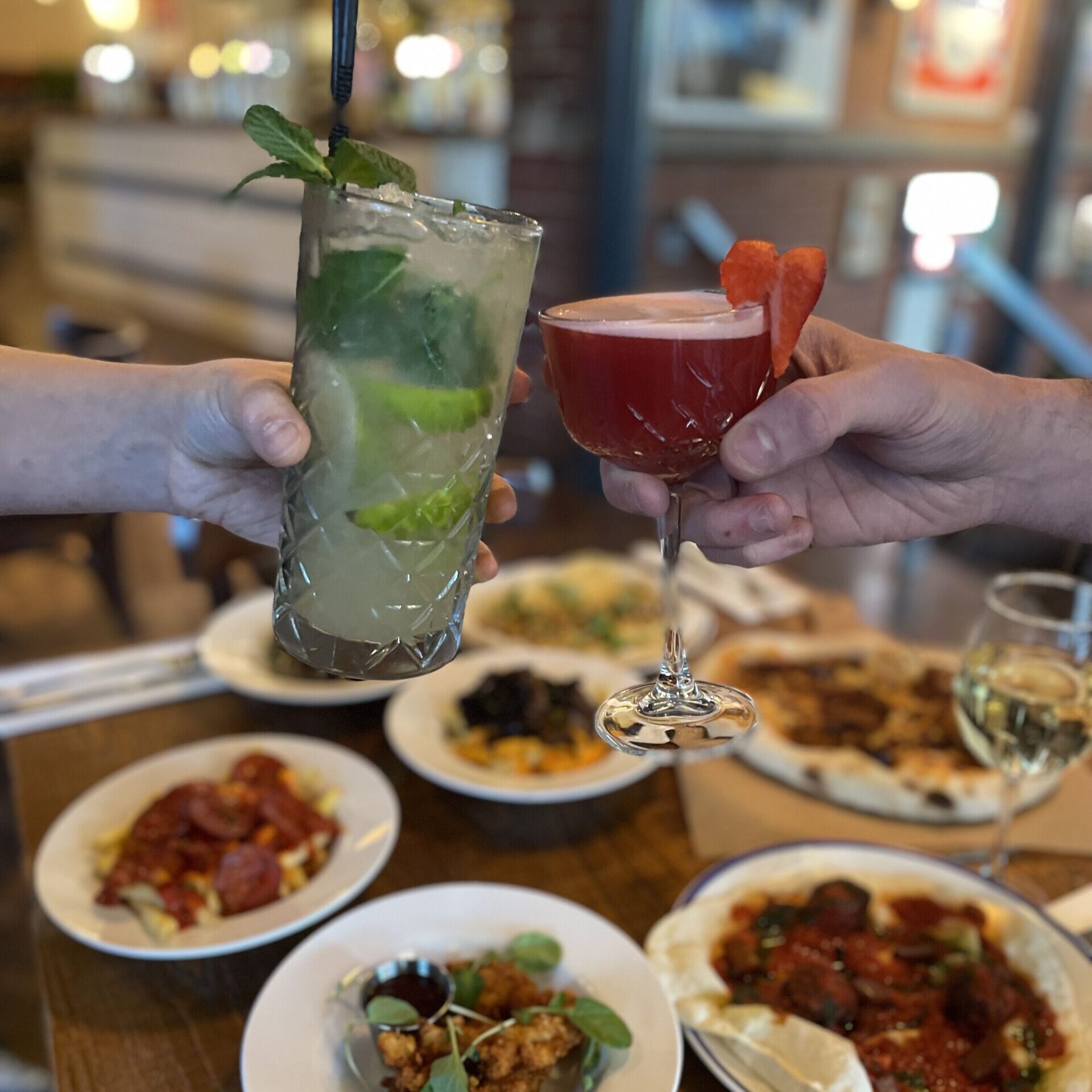 Friends sharing main meals at Forum Sheffield restaurant, enjoying 50% off dining offer in October.